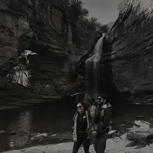 Ivan with his wife and their dog in the mountains